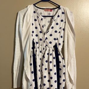 A white cardigan with polka dot navy blow pattern
